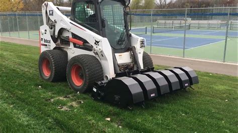 caterpillar skid steer attchmans|caterpillar skid steer aerator attachment.